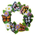 Felt wreath project with colorful butterflies and white daisy flowers and purple flowers