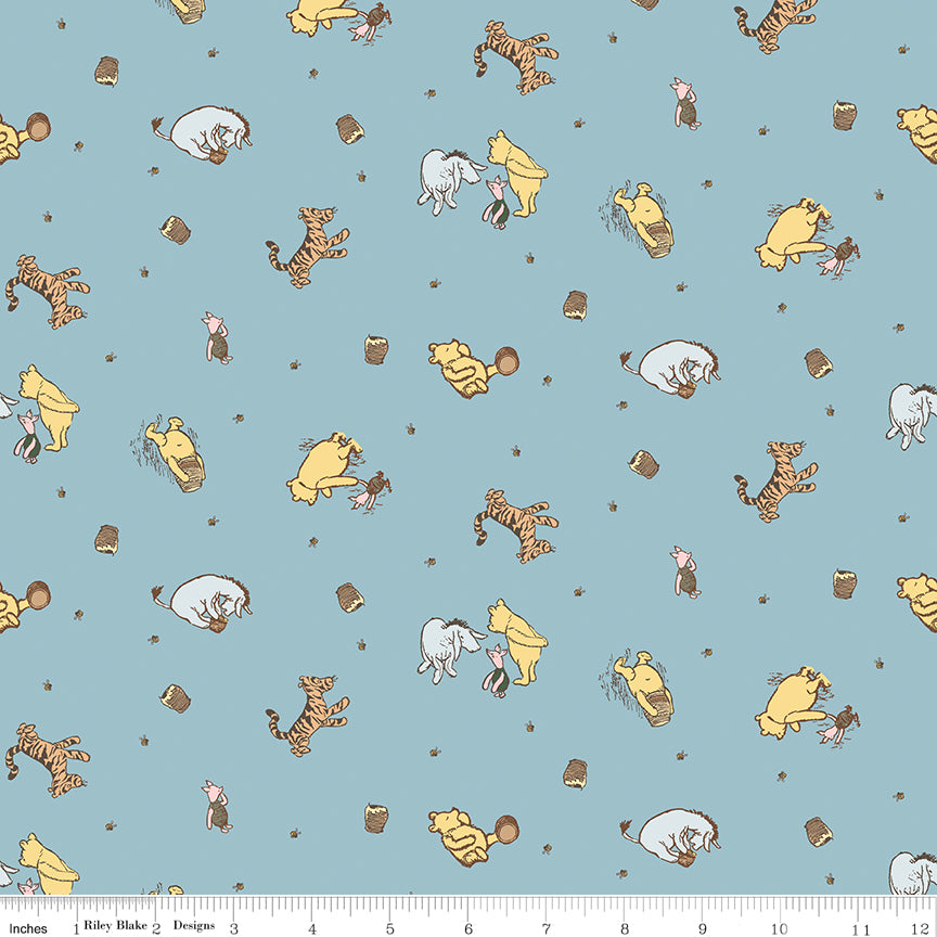 Winnie-the-Pooh Baby Character Toss Blue Quilt Fabric by Echo Park Paper Co.