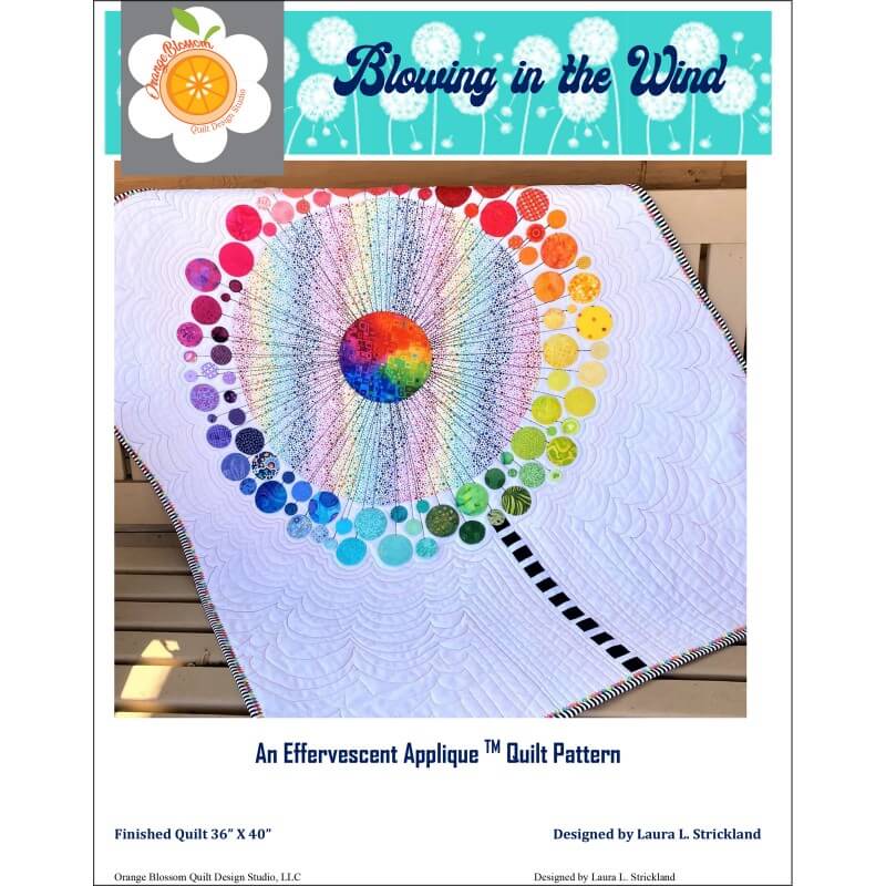 Blowing in the Wind quilt pattern with rainbow flower quilt shown
