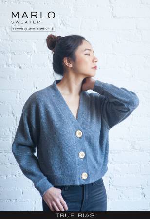 The Marlo pattern is an oversized sweater with a dropped shoulder, deep V-neck, wide bands and large buttons.
