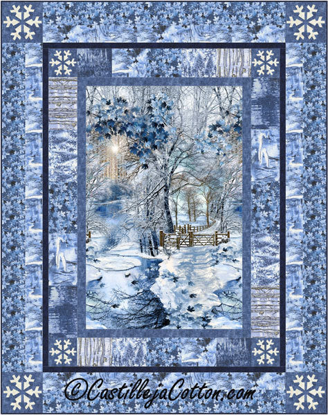 Quilt with a winter scene featuring trees and a fence, framed by snowflakes and blue patterns.