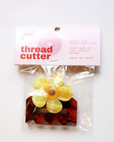 Back of the Retro Flower Thread Cutter by Feral Notions