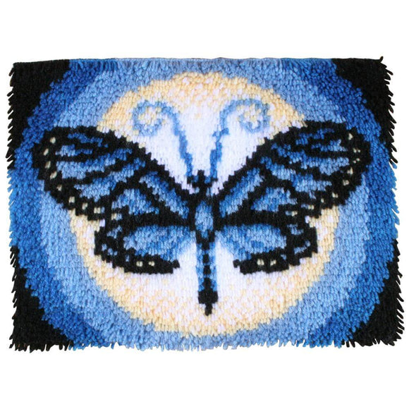 Finished product of Butterfly Moon Latch Hook kit in shades of blue