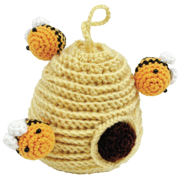 Beehive Crochet Kit finished project showing hive with three bees
