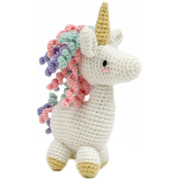 Finished product of unicorn crochet kit. White body with gold horn and pink, blue and purple mane and tail