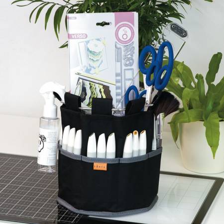 The Craft Tidy is an amazing product that combines a metal cup holder and easy-clip craft storage tote and mini trash bin all in one.