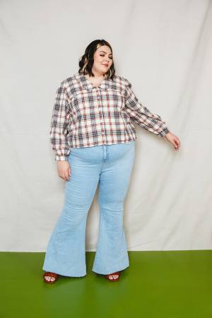 The Patina Blouse is a collared, v-neck, button up top. The sleeves are full and the pattern includes options for a short sleeve or long sleeve 