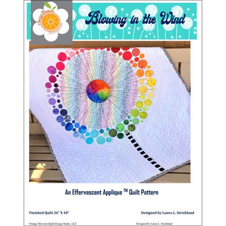 Blowing in the Wind quilt pattern with rainbow flower quilt shown