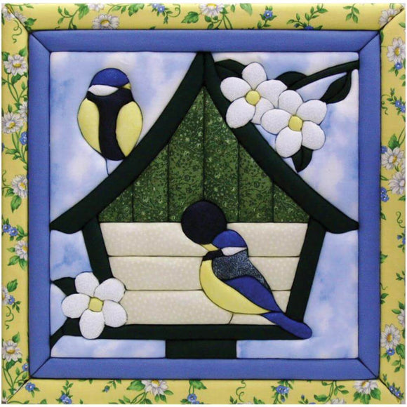 No Sew Quilt Magic Wall Hanging in blue, yellow and white showing two bluebirds on a birdhouse with white flowers