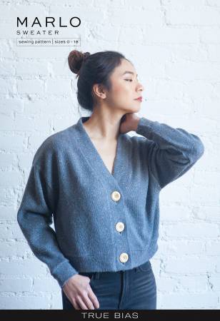 The Marlo pattern is an oversized sweater with a dropped shoulder, deep V-neck, wide bands and large buttons. 